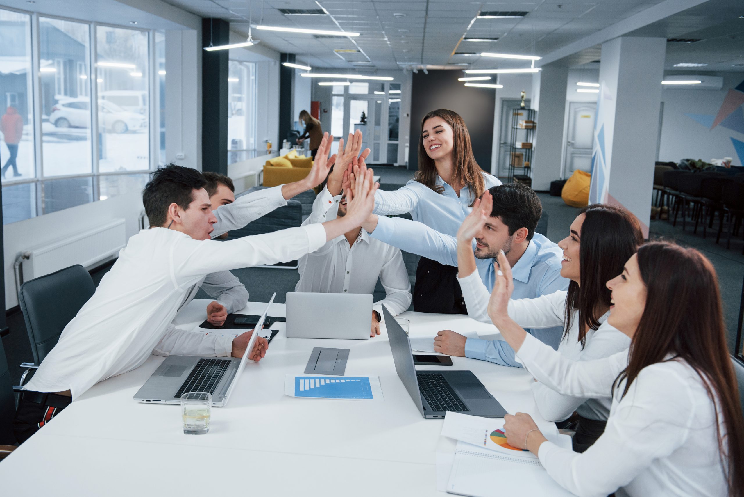 Cheerful business people. Job is done. Group of office workers happy to hit their own records and being successful.